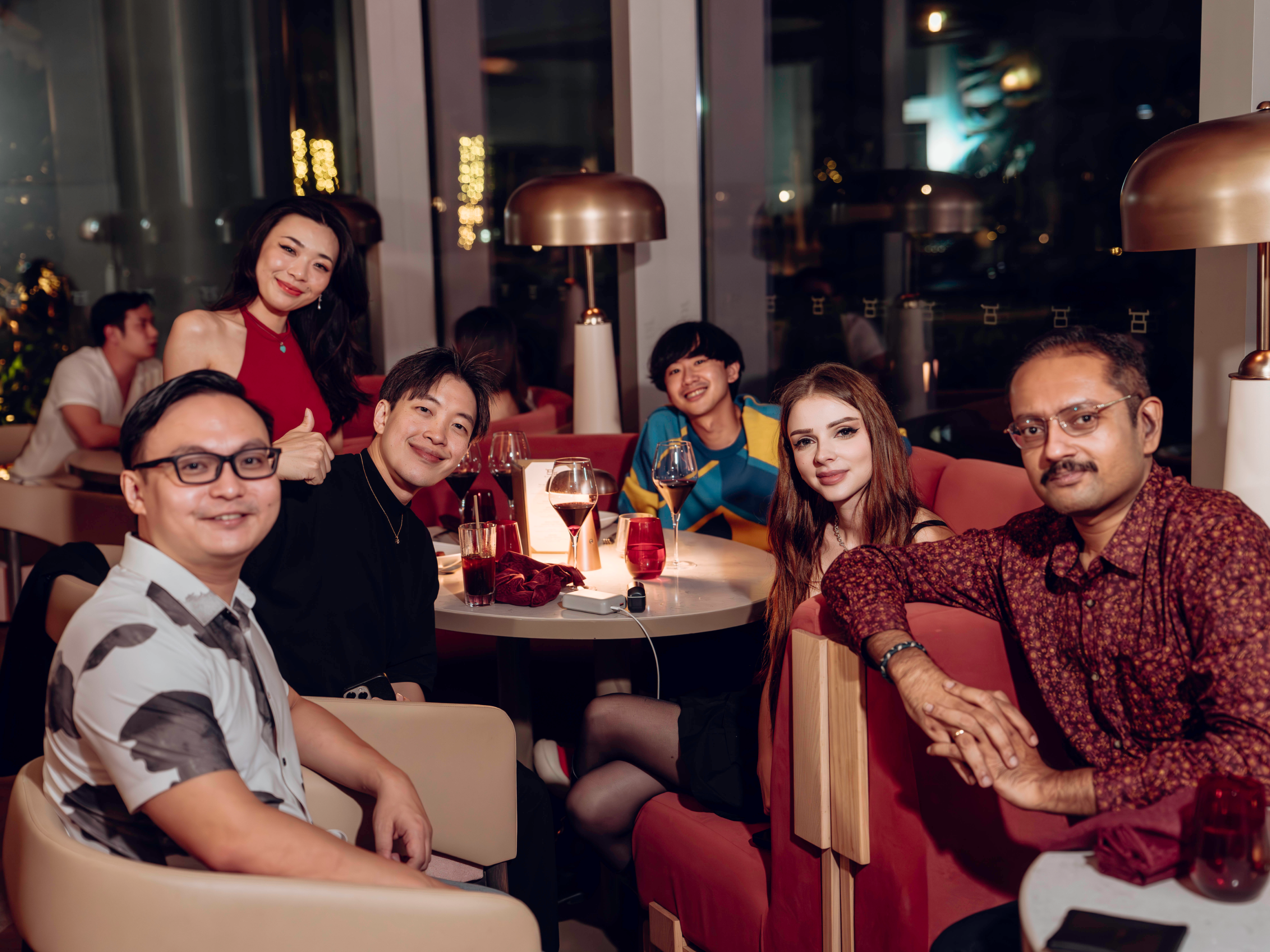 APEX AURA members around a private dinner table