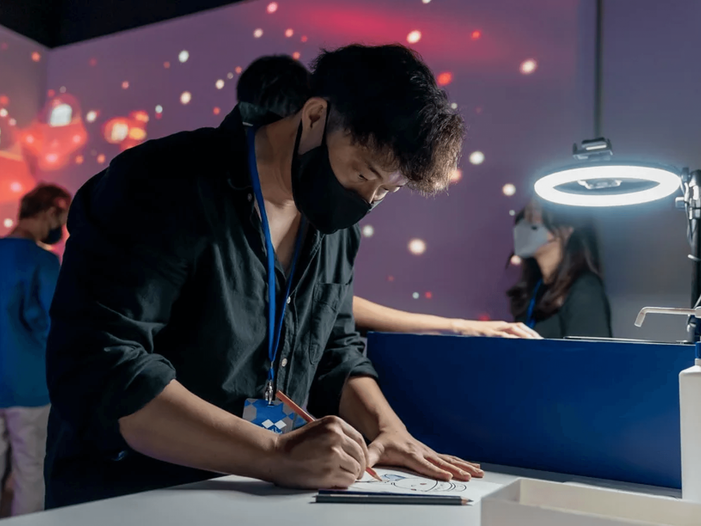 An artist creating work during a live activation